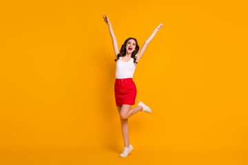 Poster - Full size photo of funny crazy cheerful lady raise hands crazy weekend sunny weather summer day wear casual white tank-top red mini skirt shoes isolated yellow bright color background