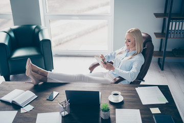 Wall Mural - Profile photo of attractive self-confident business lady notebook table read corporate report writing details personal planner legs on table sitting chair modern interior office indoors