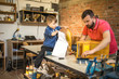 © Stock Rocket - Father and Son Making a Birdhouse