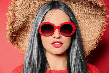 Poster - Portrait of young woman with beautiful grey colored hair on red background