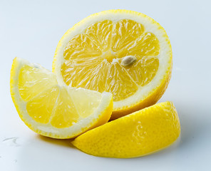 Sticker - lemon sliced on a light background