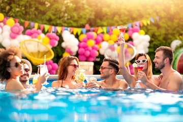 Group of friends have pool party.