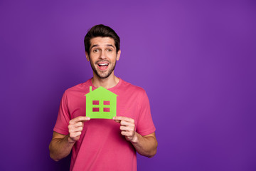 Sticker - Portrait of his he nice attractive glad happy guy holding in hands green eco friendly paper form rental live isolated over bright vivid shine vibrant violet lilac purple color background