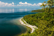 canvas print picture - Overlooking Tennison Bay within Peninsula State Park, Fish Creek, Door County, Wisconsin in early June, as the distant clouds reflect off the calm Green Bay waters.