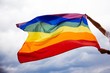 © belyaaa - LGBT flag blown in the wind. Freedom and love concept. Pride month in June.