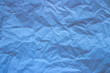 © Sofya - light blue trendy paper texture. Crumpled paper in light blue color.