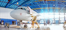 Panoramic View Of Aerospace Hangar, Civil Aviation Aircraft, Repair And Maintenance Of Mechanical Parts In An Industrial Workshop.