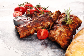 Grilled spare ribs for a tasty bbq meat with hot spicy barbecue sauce