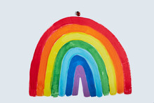 Thank To NHS. Childrens Hand Drawing Rainbow On Paper. Greating Card For Nurses. Ladybug Sat On A Postcard
