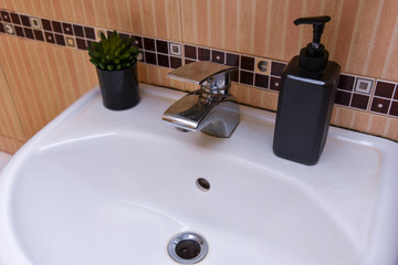 Bathroom interior with sink and faucet in an ordinary house