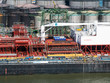 © STUDIO MELANGE - Rotterdam, Netherlands - May 07, 2020: view on the cargo port buildings infrastructure from cruise ship