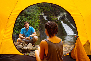 Wall Mural - couple camping near waterfall