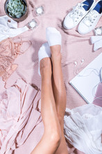 Slim Beautiful Woman Legs On Pastel Pink Knitted Plaid