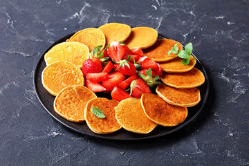 Canvas Print - oatmeal pancakes with strawberries, top view