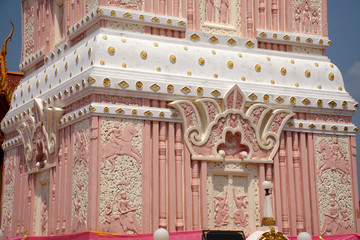 Pink and white color pagoda or stupa of Wat Phra That Renu Nakhon temple for foreign traveler and thai people travel visit and respect praying buddha and buddha's relics in Nakhon Phanom, Thailand