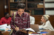 © Rido - Young student girl studying in library