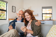 © Rido - Mature couple doing online shopping with digital tablet