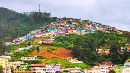 Wall Mural - Ooty, India time-lapse during cloudy day. Aerial view of Nilgiri mountain village in Tamil Nadu, India. Ooty is a popular resort with beautiful nature, zoom in