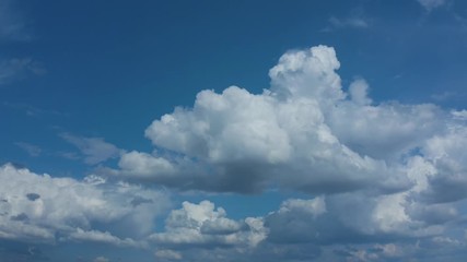 movement of clouds in the blue sky.