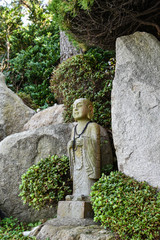 Wall Mural - Busan city, South Korea - NOV 01, 2019: Little monk figurines at Haedong Yonggungsa Temple is the most beautiful temple in Korea.
