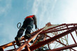 © kitawit - engineer climb high tower to maintenance working,safety work with PPE,telecom tower for 5G network