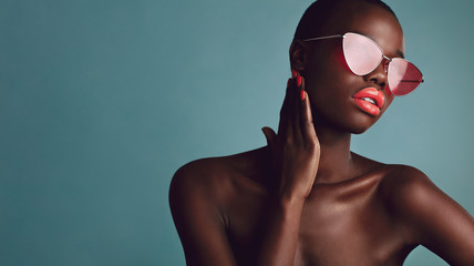 Wall Mural - African female model with trendy sunglasses