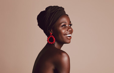 Wall Mural - Smiling african woman with a turban