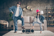 Photo Of Two People Grandparent Little Granddaughter Cool Vintage Style Sun Specs Denim Outfit Hat House Party Listen Tape Player Leg On Recorder Stay Home Quarantine Living Room Indoors