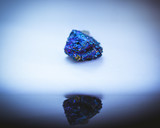 Fototapeta Tęcza - Gasoline stone on blue background
