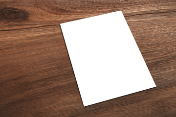 Wall Mural - mockup billboards or white promotion poster displayed or white paper laid on brown wood panels, shop
