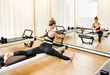 Woman doing a stretch lunge pilates exercise