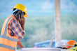 © visoot - Construction worker talking on the phone at the construction site,Engineer,Construction concept.