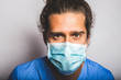 © marc - young adult wearing a medic mask and medic uniform