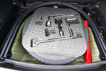 Vehicle tool kit with spare wheel