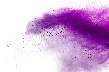 Wall Mural - Explosion of colored powder on white background.Purple and pink dust splash.