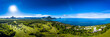 © Westend61 - Mauritius, Black River, Flic-en-Flac, Helicopter panorama of sun shining over Indian Ocean and coastal village