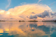 © Westend61 - Beautiful sunset with clouds and reflections on the water, Male, Maldives
