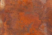 Orange Red Old Rusty Metal Surface. An Weathered Oxidized Patina With A Copper Color, Texture And Structure. Vintage Material Effect