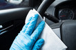 © Andrey Popov - Cleaning Car With Sanitizer Wipe Against Virus