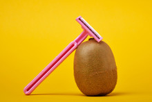 A Shaving Machine And A Shaved Kiwi On A Yellow Background