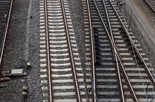 Multiple Railroad Tracks With Junctions At A Railway Station In A Perspective View