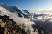 Clouds And Fog Near Dome Du Gouter And Bosson Glacier Mont Blanc Massif In The French Alps. View From The Cosmique Refuge, Chamonix, France. Perfect Moment In Alpine Highlands.