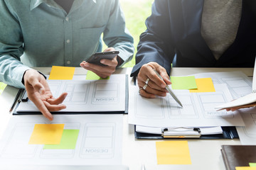 designer men planning develop application develop for mobile phone.