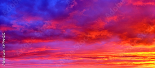 Mellow Sunset Sky Landscape Background Natural Color Of Evening Cloudscape Panorama With Sun Below Horizon Ultra Wide Panoramic View Red Orange And Blue Colors Of Evening Nature Buy This Stock Photo