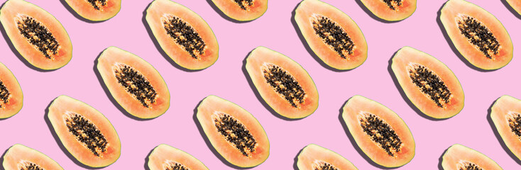 Wall Mural - Seamless pattern with papaya. Tropical abstract background. Top view. Creative design, minimal flat lay concept. Summer time. Tropical travel, exotic papaya fruit. Vegan and vegetarian food