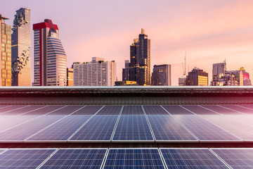 Solar Panel Photovoltaic installation on a Roof of factory, sunny blue sky background, alternative electricity source - Sustainable Resources Concept.