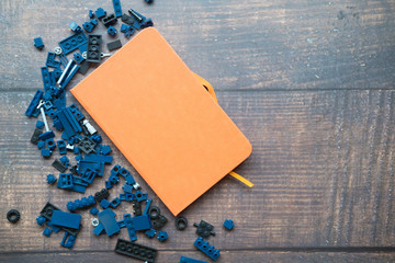 Wall Mural - Blue of plastic blocks on wood table