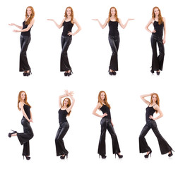 Wall Mural - Redhead woman in black bell bottom pants on white