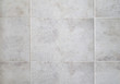 Beige and white squared ceramic tile with craquelure pattern. Abstract Texture Background