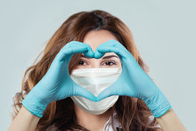 Smiling Doctor In Protective Mask Making Heart, Close Up Portrait